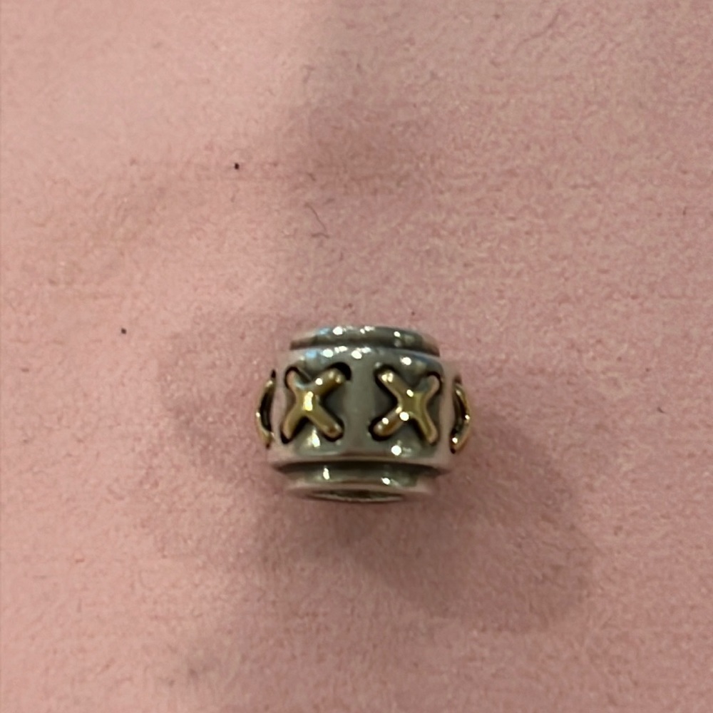 Pandora sterling Charm with 14kt gold X pattern.790290